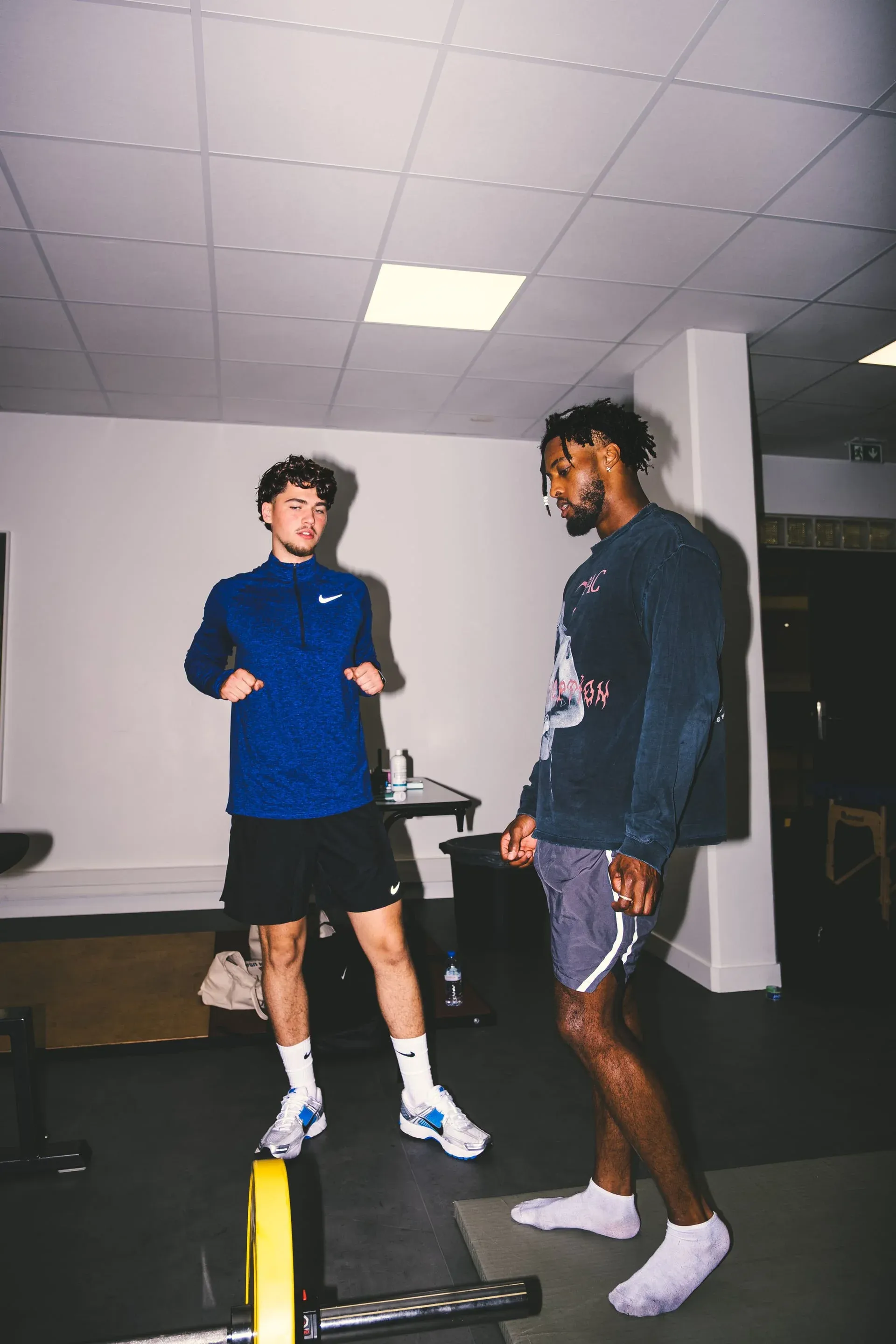 Nicolas Rausch explaining a drill to Denzel Ward